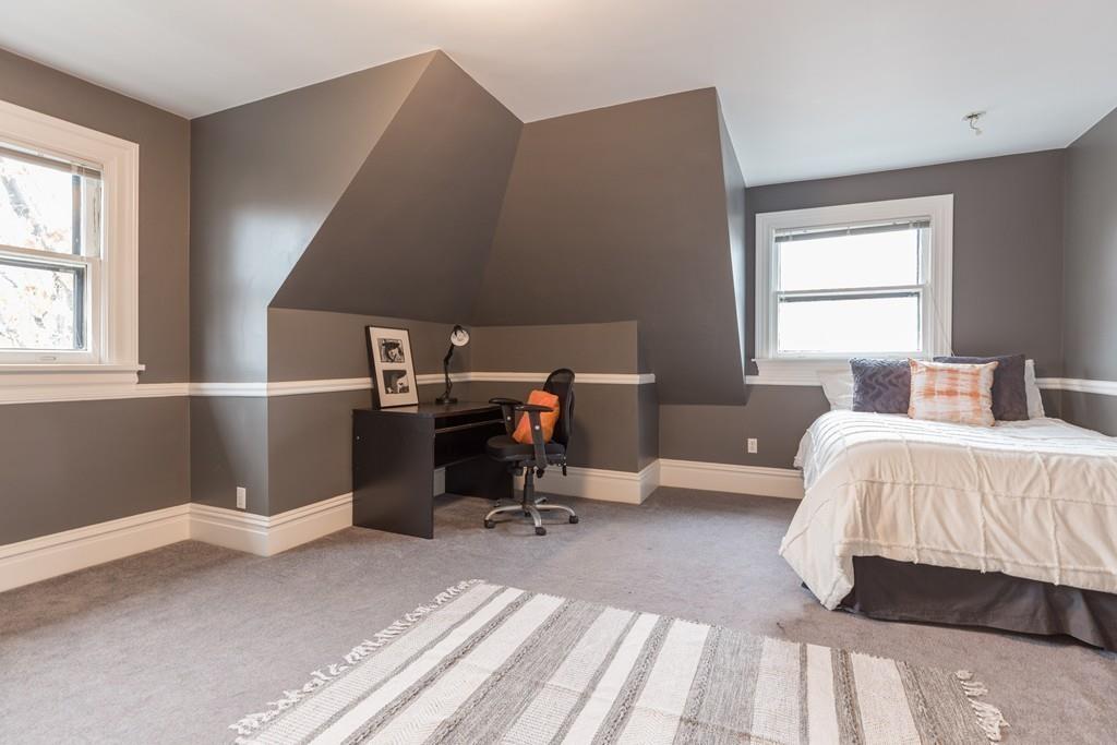 33 Naples Road Brookline, MA 02446 - Photo 25 of 31 a bedroom with a bed and a window