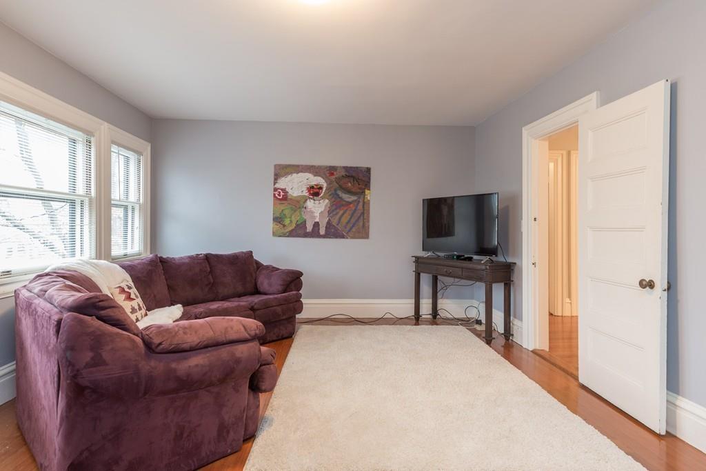 33 Naples Road Brookline, MA 02446 - Photo 28 of 31 a living room with furniture and a flat screen tv