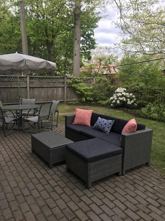 33 Naples Road Brookline, MA 02446 - Photo 30 of 31 an outdoor sitting area with furniture and wooden floor