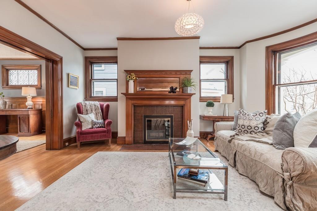 33 Naples Road Brookline, MA 02446 - Photo 5 of 31 a living room with furniture and a fireplace