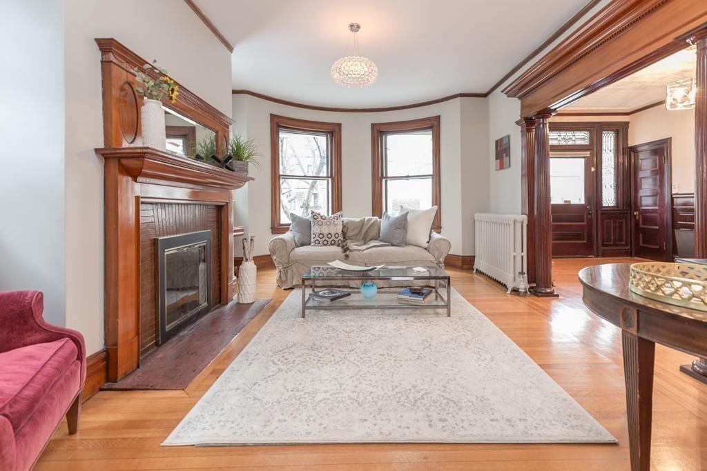 33 Naples Road Brookline, MA 02446 - Photo 6 of 31 a living room with furniture and a fireplace