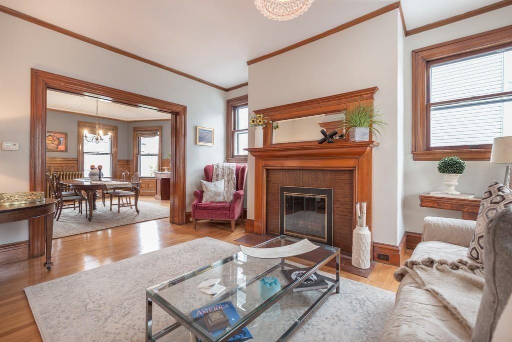 33 Naples Road Brookline, MA 02446 - Photo 7 of 31 a living room with furniture and a fireplace