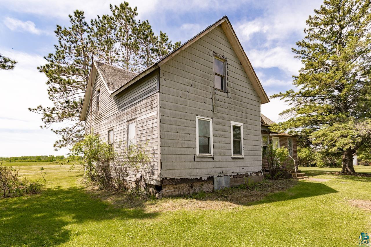 6606 Metso Road Kettle River, MN 55757 - Photo 77 of 84 Two-story residential structure with horizontal siding and an exposed stone foundation