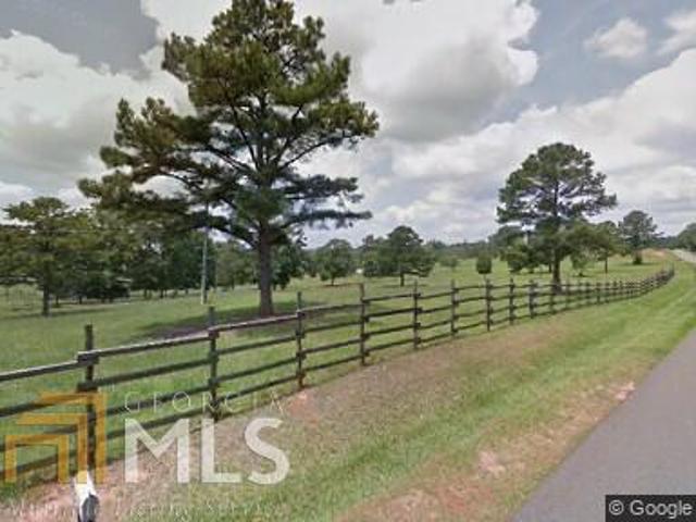 1522 Roland Road Thomaston, GA 30286 - Photo 1 of 1 a view of a yard with wooden fence