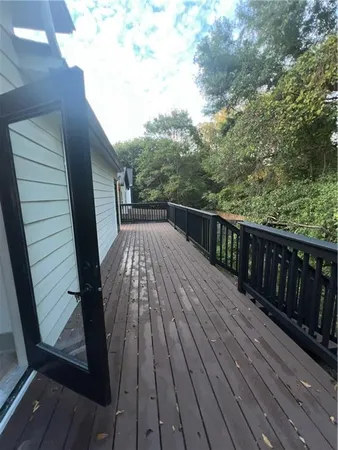 a balcony with wooden floor
