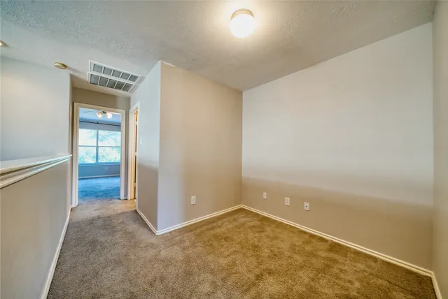 a view of a bathroom with a toilet sink and mirror