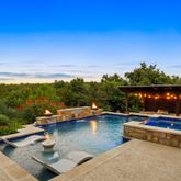 a view of swimming pool with lounge chair