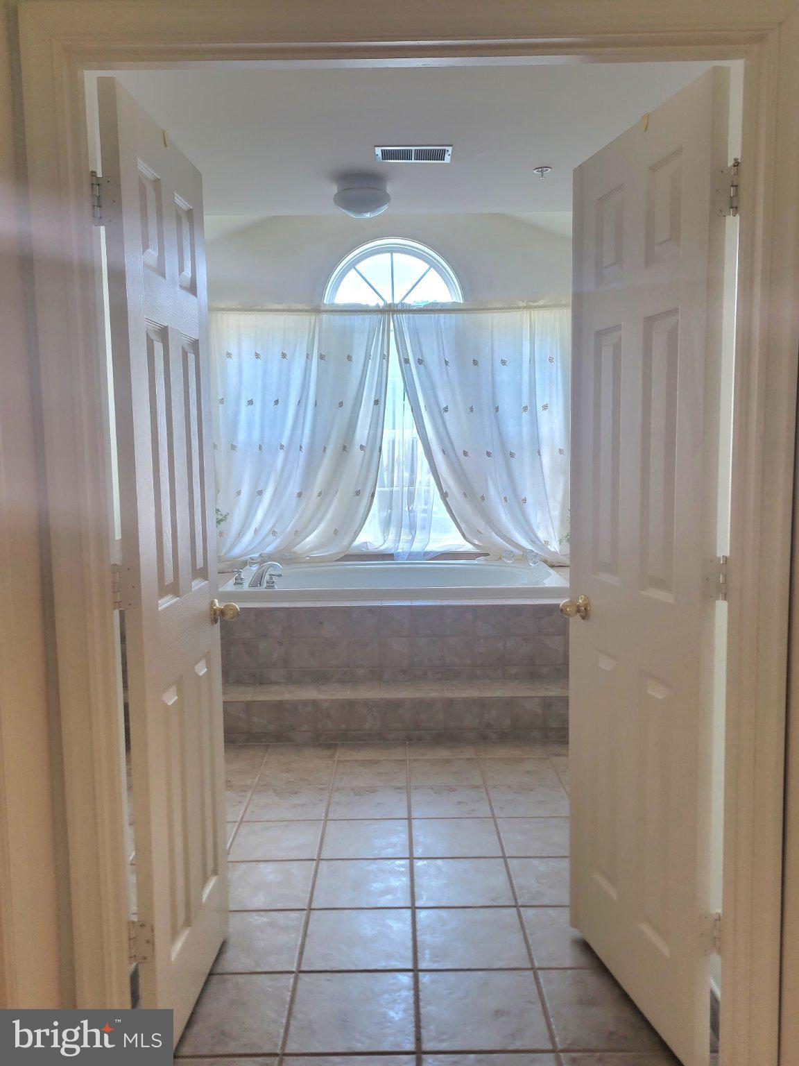 1202 Strausberg Street Accokeek, MD 20607 - Photo 32 of 43 Bright and airy bathroom entrance.