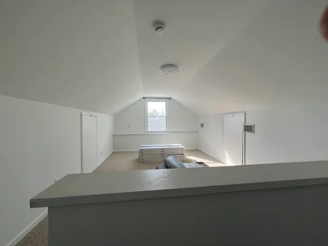 a bathroom with a double vanity sink and mirror