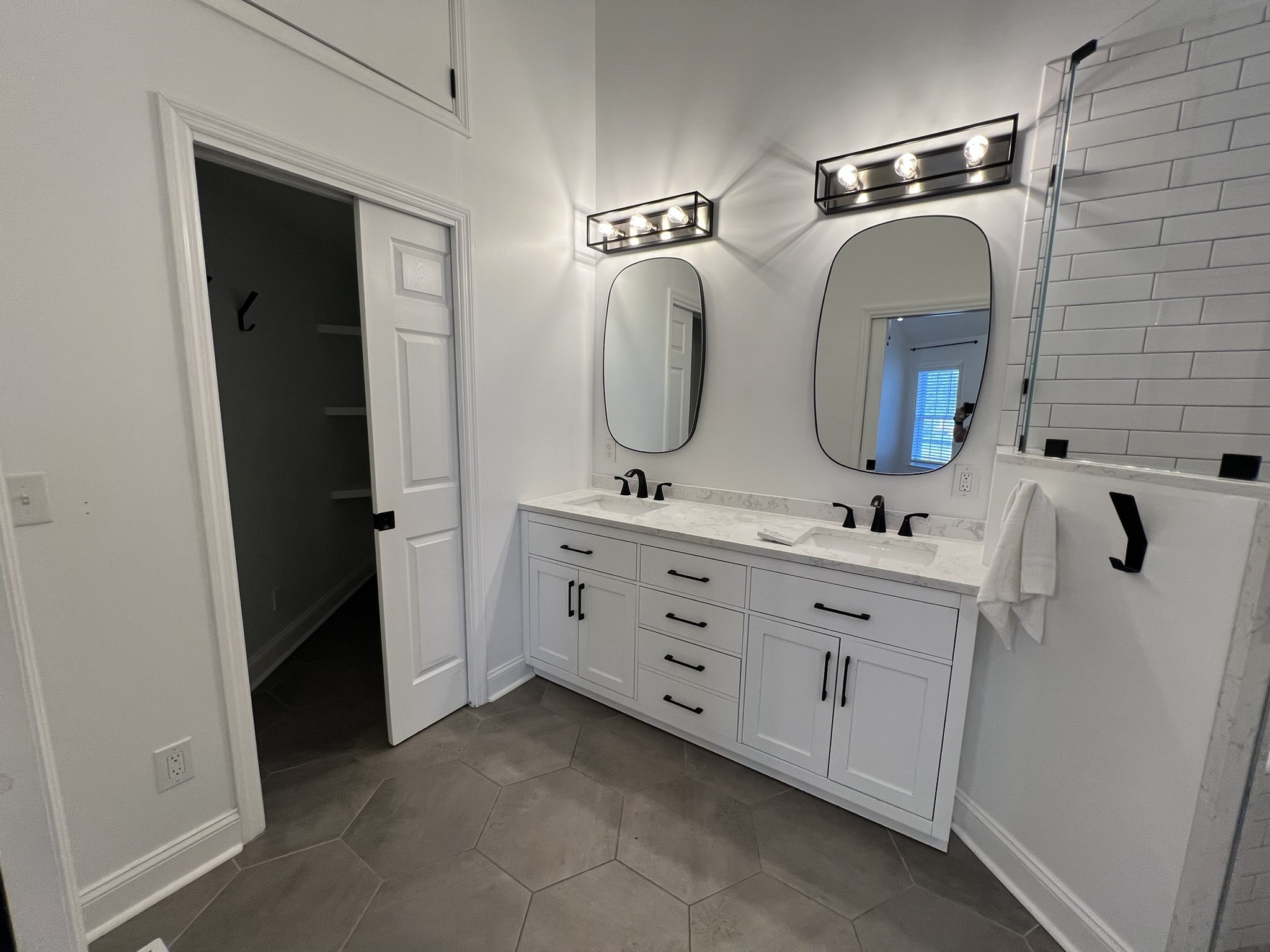 2654 Crosspark Drive Murfreesboro, TN 37129 - Photo 26 of 36 a bathroom with a double vanity sink and a mirror