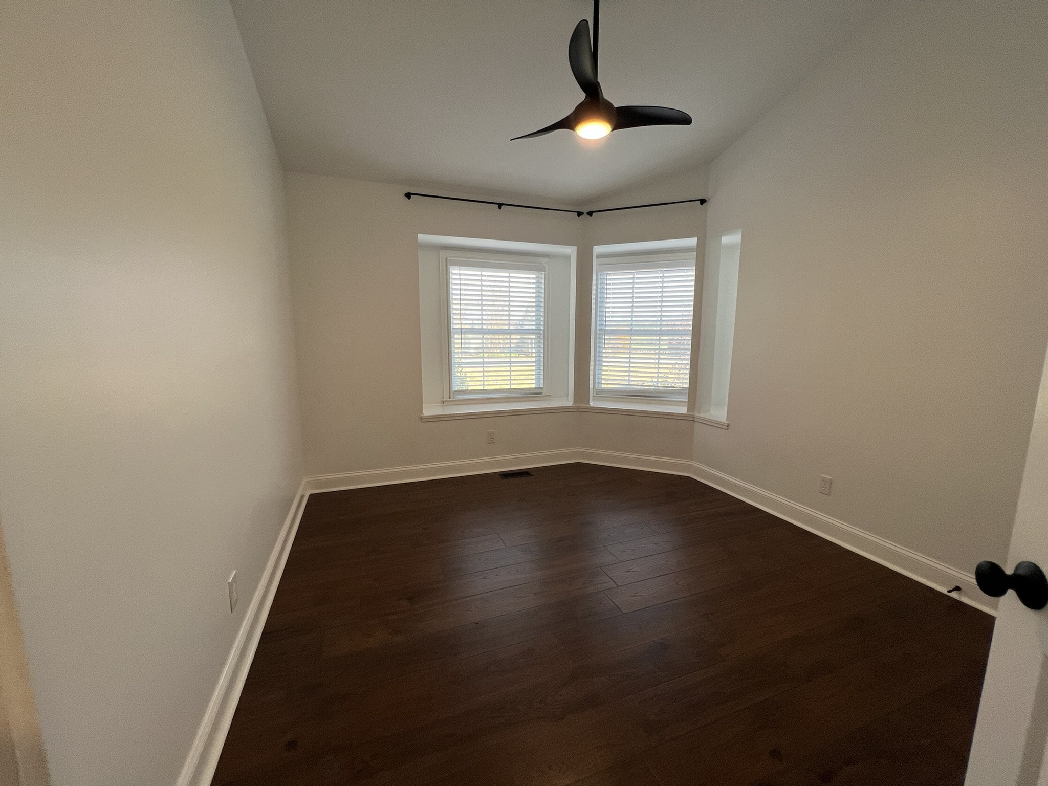 2654 Crosspark Drive Murfreesboro, TN 37129 - Photo 33 of 36 an empty room with wooden floor and windows