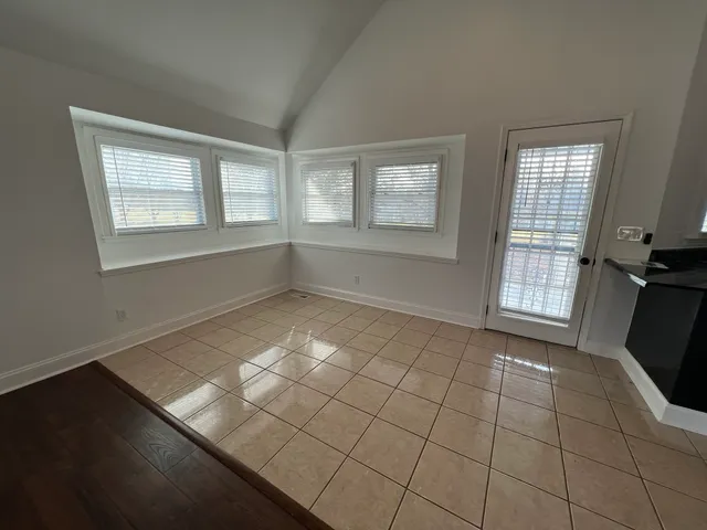 a kitchen with stainless steel appliances granite countertop a refrigerator a stove a sink and a granite counter tops