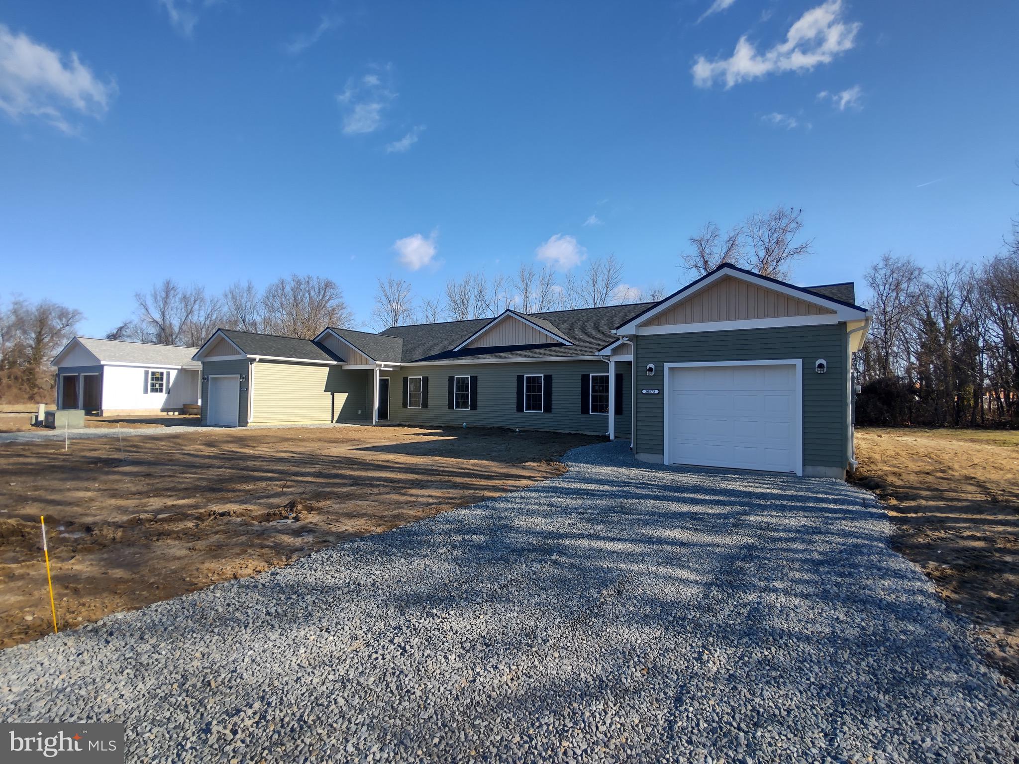 30576 Skipjack Circle, Unit 47 Princess Anne, MD 21853 - Photo 2 of 11 a front view of a house with a yard