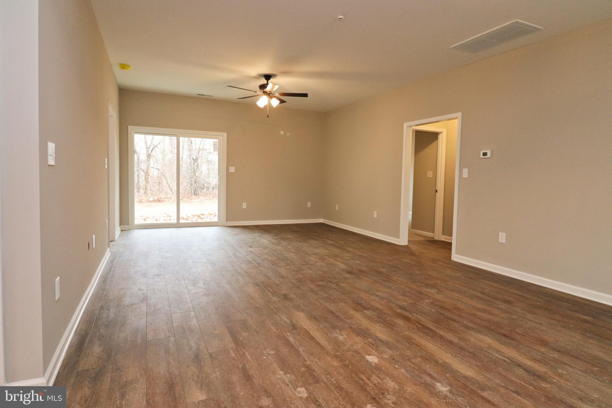 30576 Skipjack Circle, Unit 47 Princess Anne, MD 21853 - Photo 4 of 11 a view of empty room with wooden floor and fan