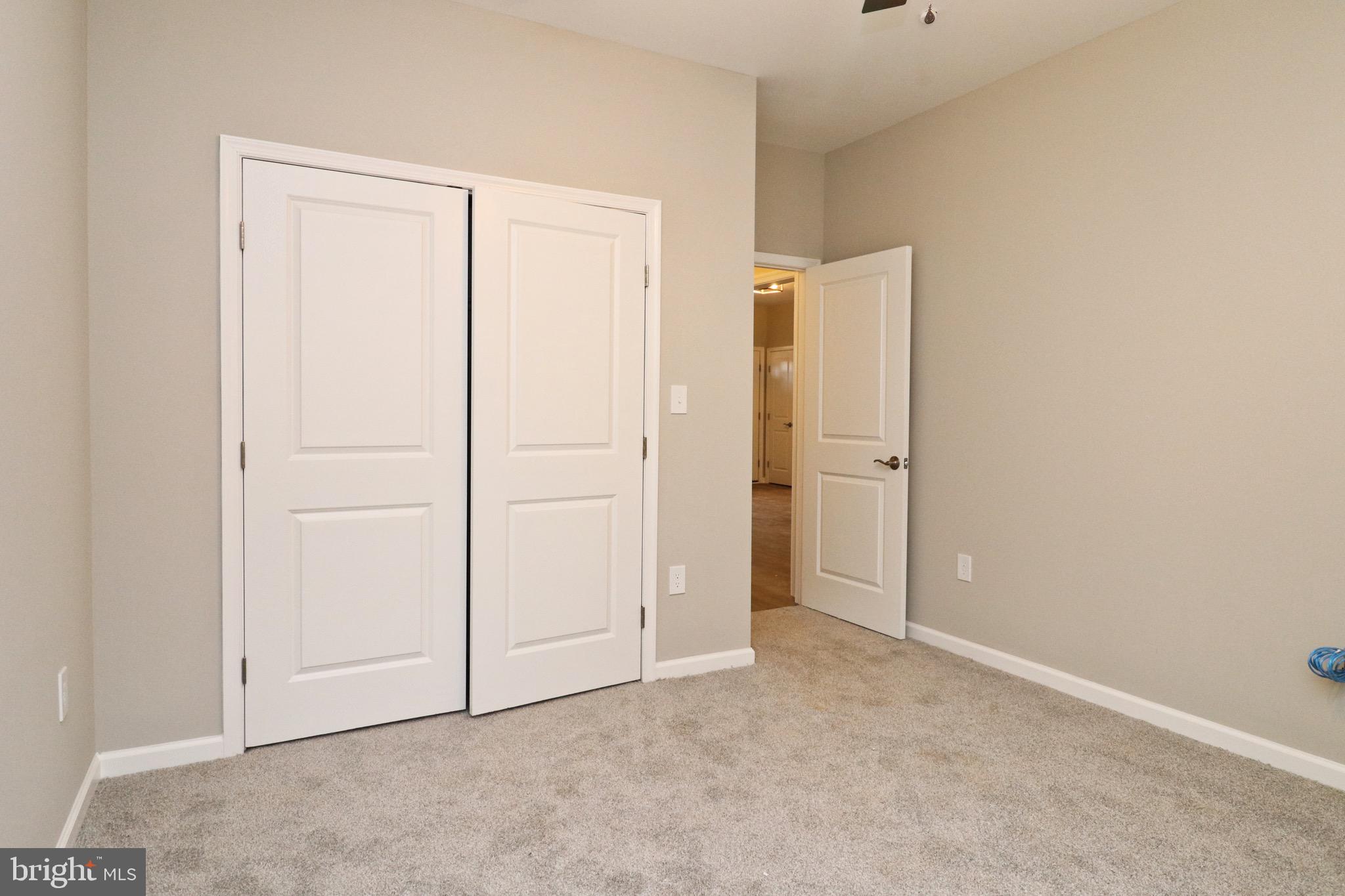 30576 Skipjack Circle, Unit 47 Princess Anne, MD 21853 - Photo 7 of 11 an empty room with closet area