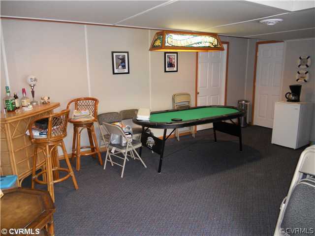 2361 Camelback Road Maidens, VA 23102 - Photo 12 of 12 a room with furniture and wooden floor