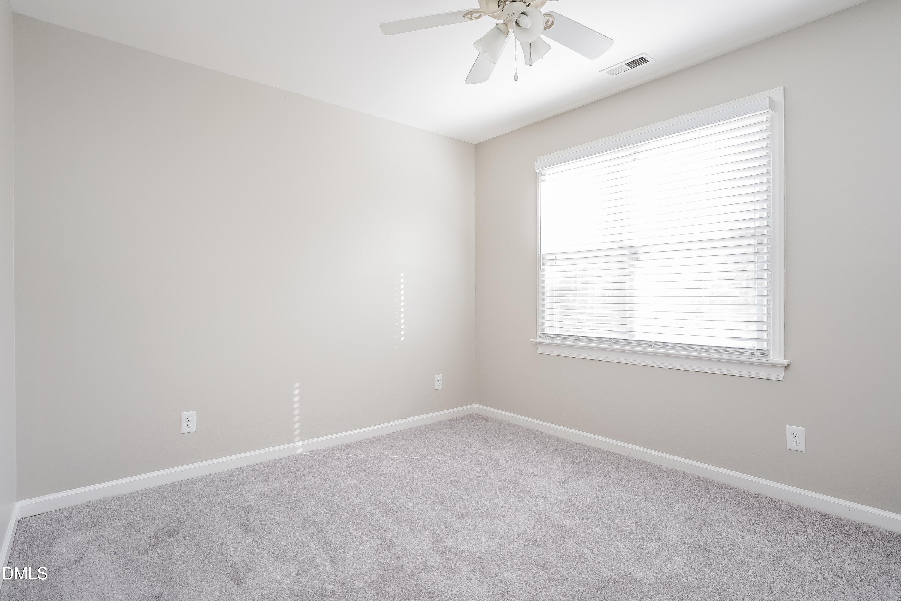 17 Edinburgh Place Clayton, NC 27527 - Photo 11 of 17 an empty room with a window