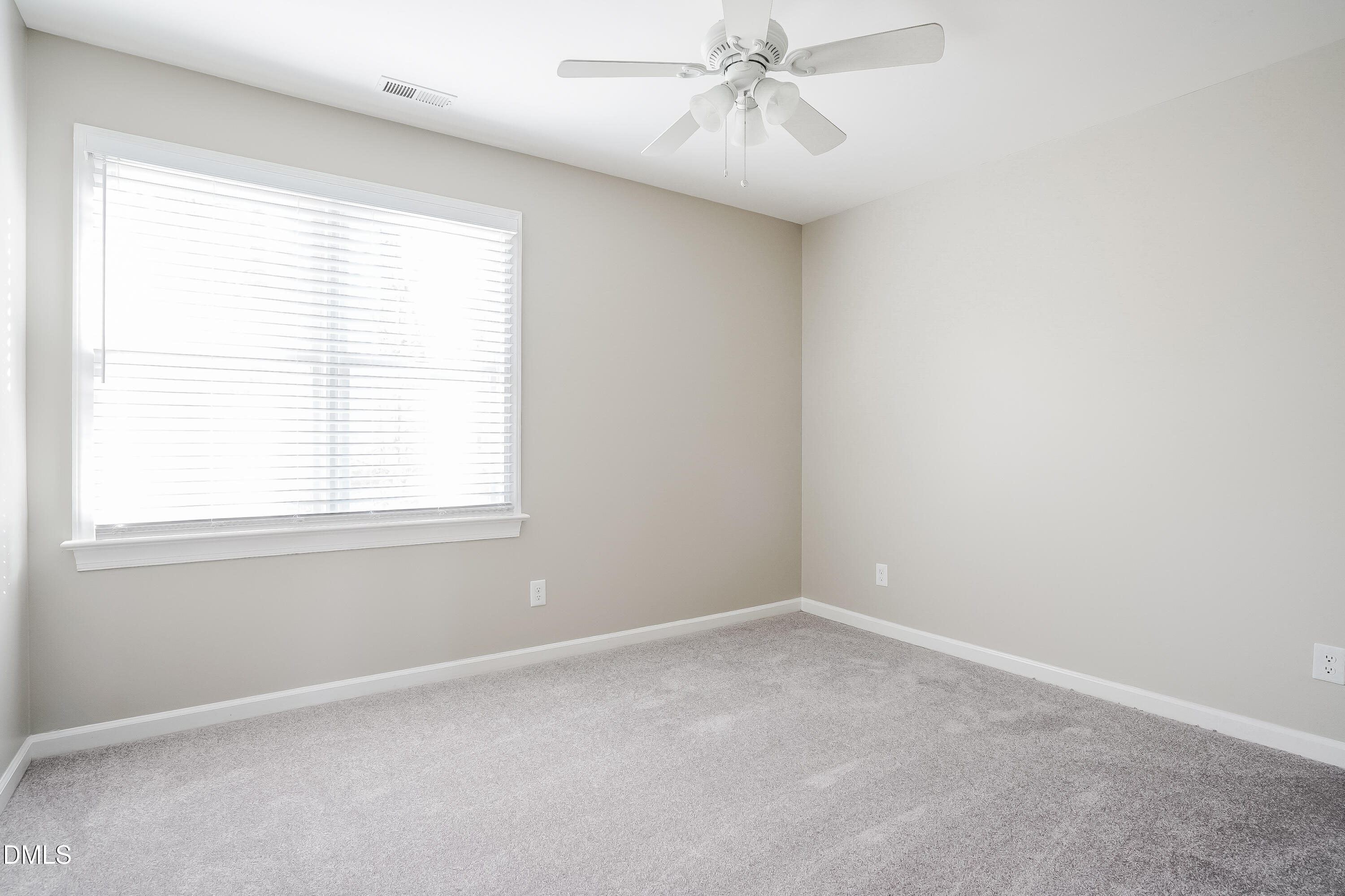 17 Edinburgh Place Clayton, NC 27527 - Photo 12 of 17 an empty room with a window