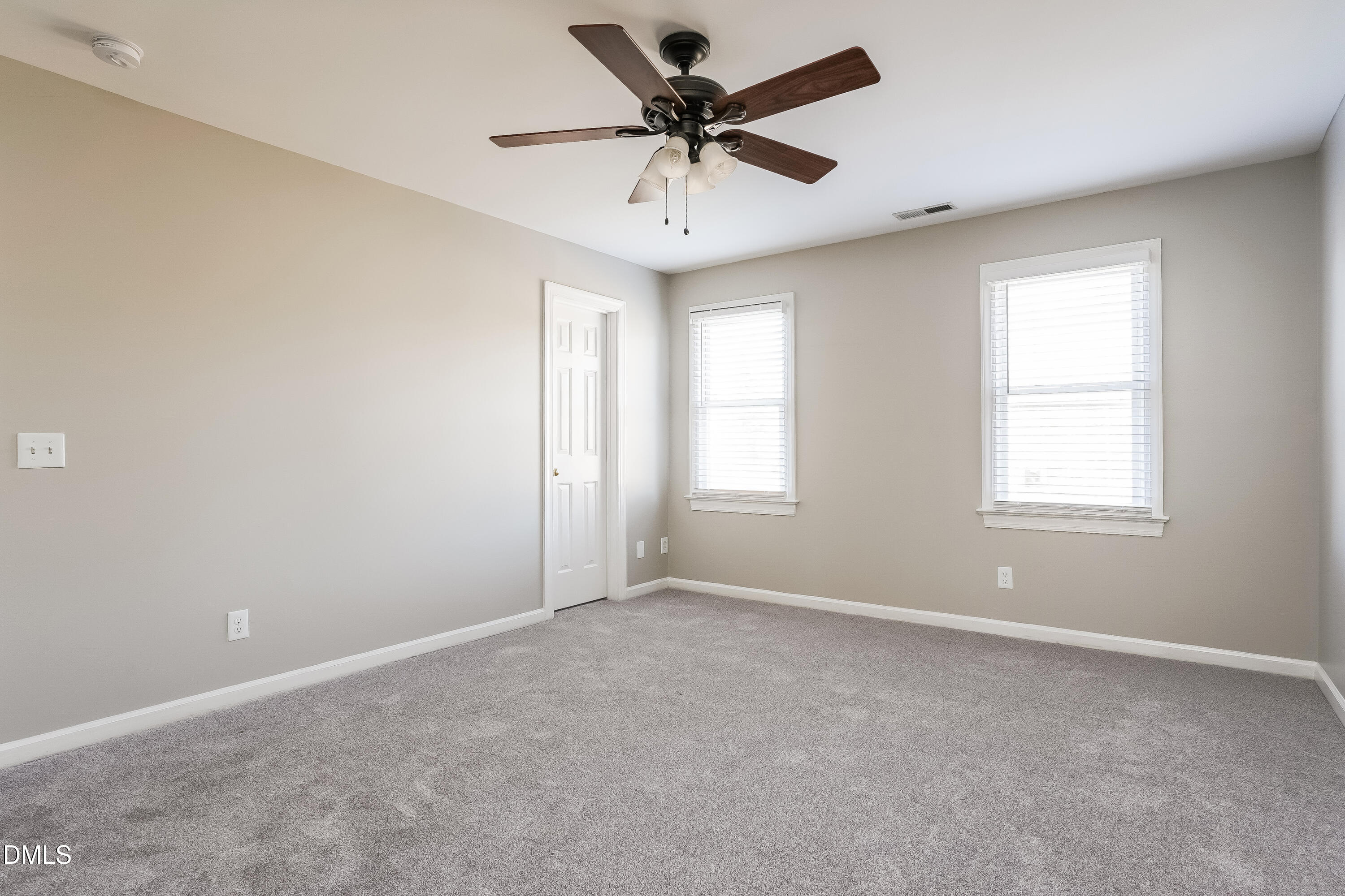17 Edinburgh Place Clayton, NC 27527 - Photo 9 of 17 a view of a livingroom with a ceiling fan and window