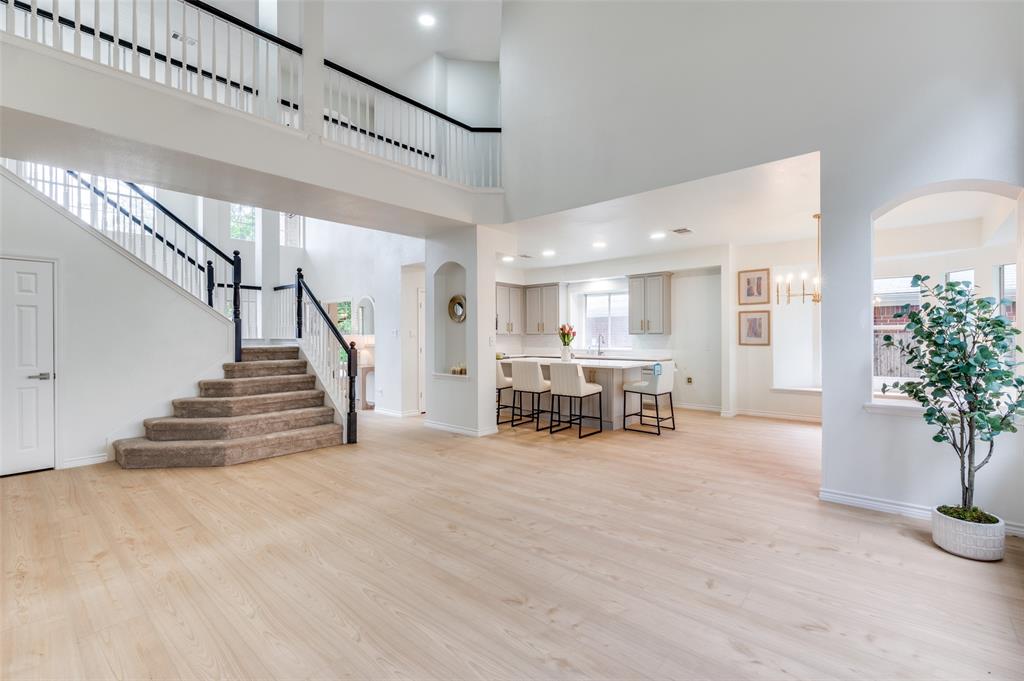 7016 Sunburst Trail Denton, TX 76210 - Photo 1 of 1 a view of a livingroom with furniture and stairs