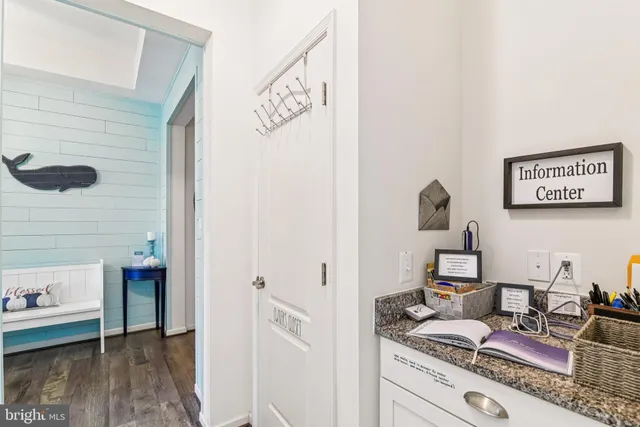 a hallway with a view of living room