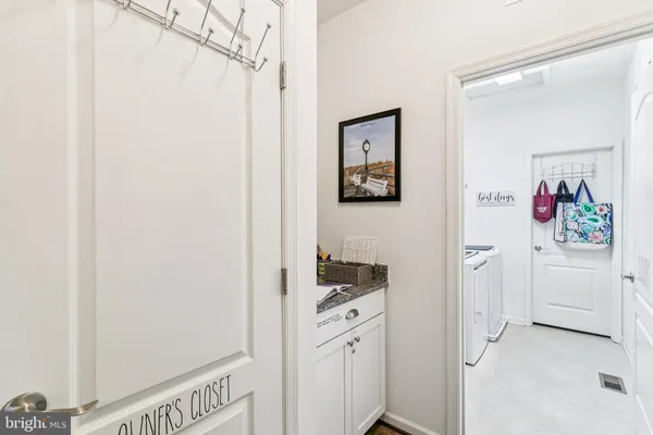 a bathroom with a sink mirror and vanity