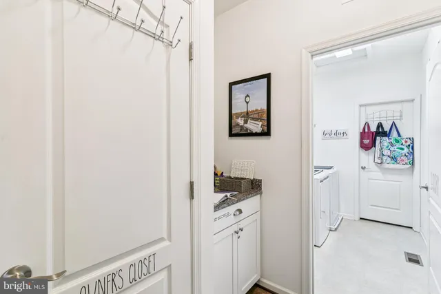 a bathroom with a sink mirror and vanity
