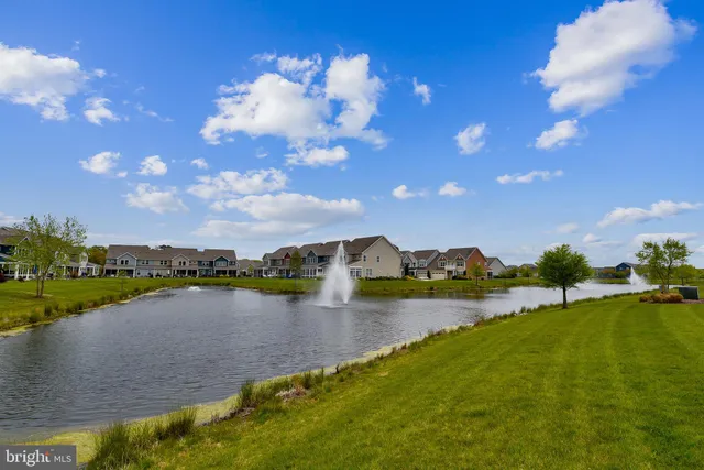 a view of a balcony with a yard