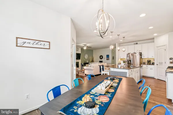 a very nice looking living room with stainless steel appliances