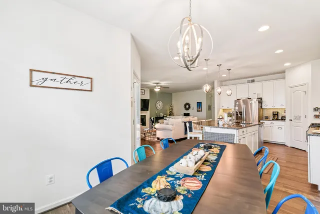 a very nice looking living room with stainless steel appliances