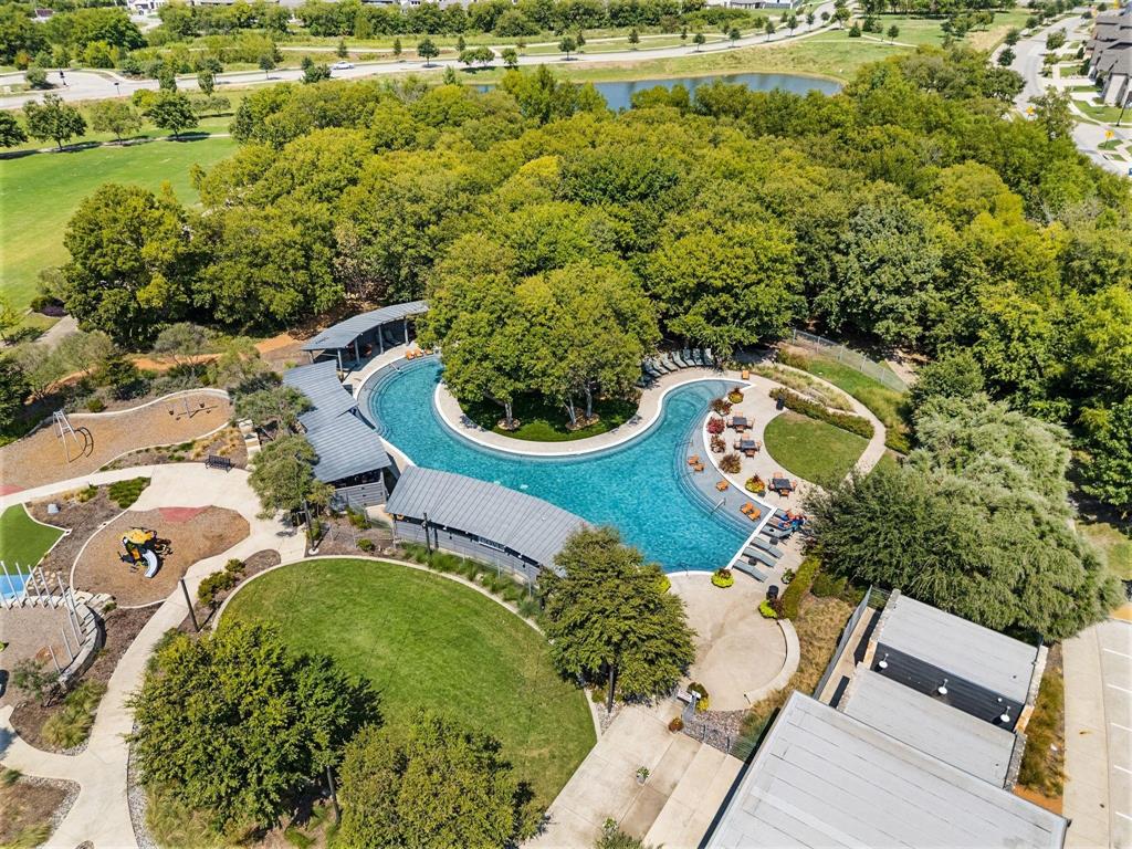 7416 Sequoia Rdg Road Little Elm, TX 76227 - Photo 37 of 37 Resort-style pool with integrated seating, surrounded by mature trees