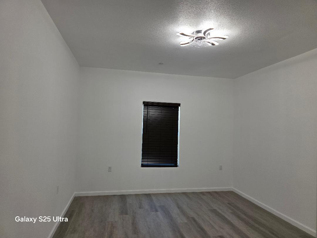 36768 Verde Avenue Madera, CA 93636 - Photo 17 of 17 an empty room with a window