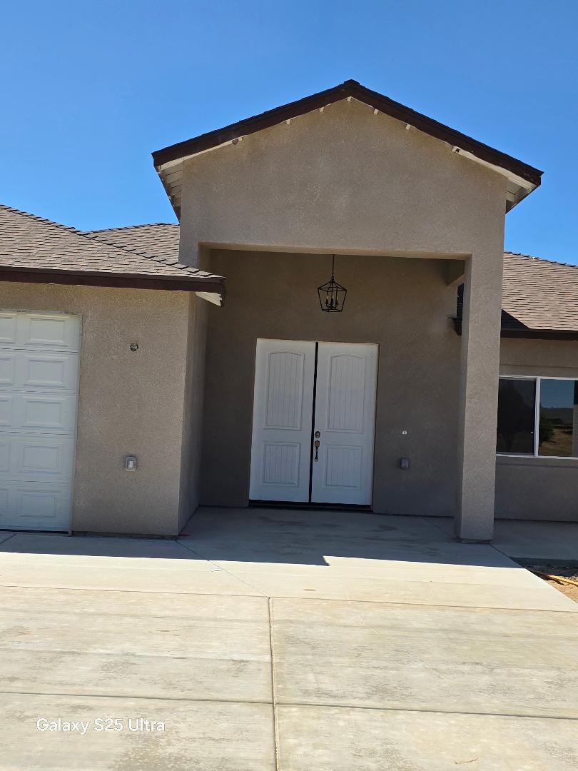 36768 Verde Avenue Madera, CA 93636 - Photo 3 of 17 a house with trees in the background