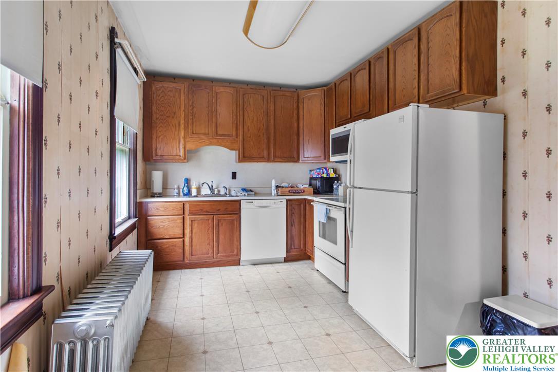 170 South Whitfield Street Nazareth, PA 18064 - Photo 13 of 29 a kitchen with a refrigerator sink stove and cabinets