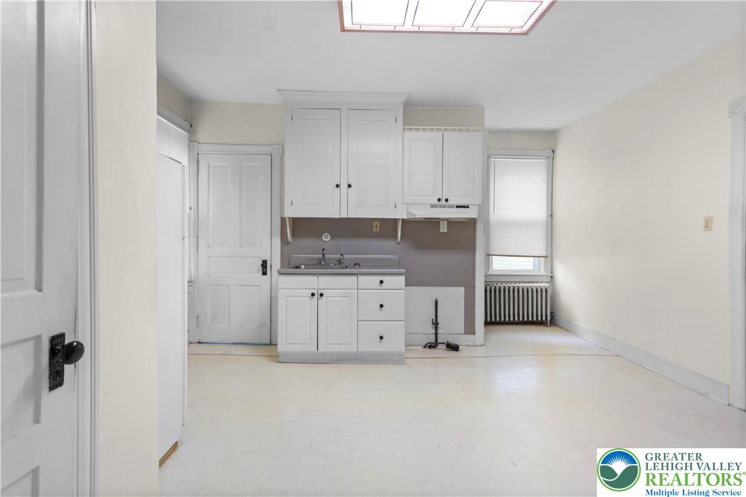 170 South Whitfield Street Nazareth, PA 18064 - Photo 16 of 29 a kitchen with granite countertop a white stove a sink and a refrigerator