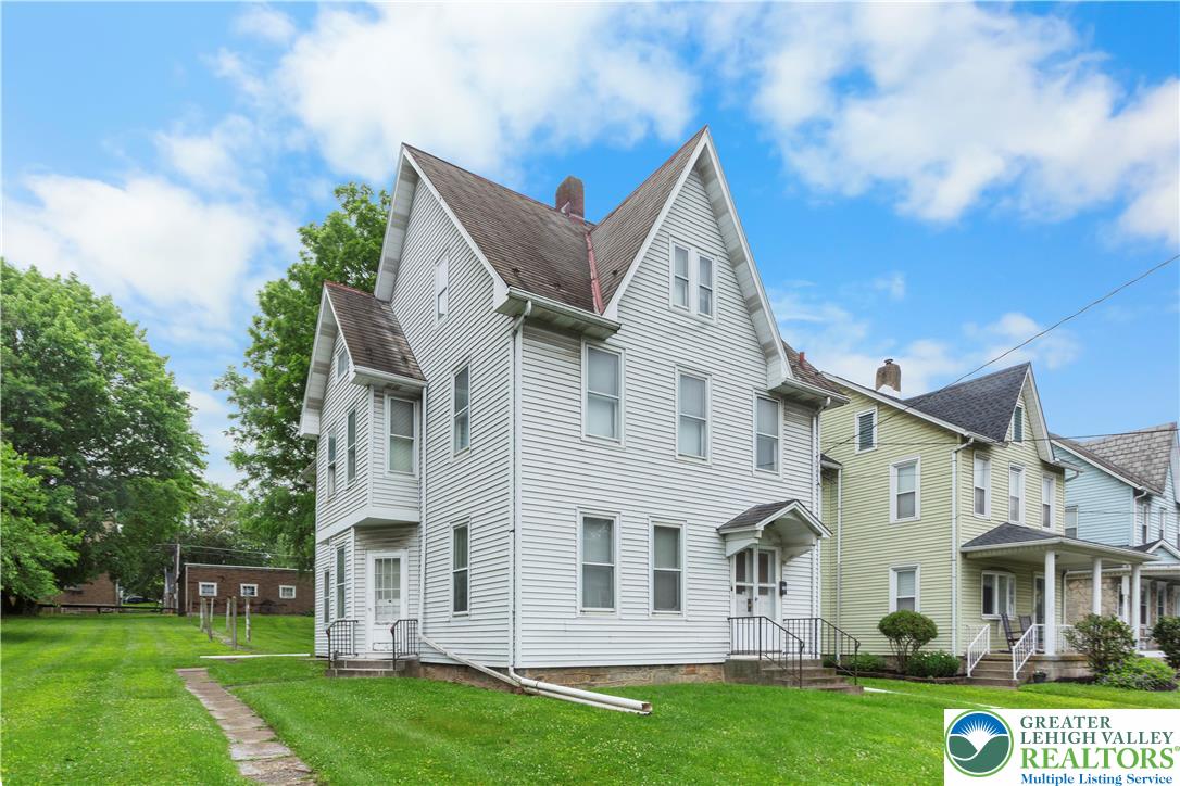 170 South Whitfield Street Nazareth, PA 18064 - Photo 29 of 29 a view of a white house with a big yard and potted plants