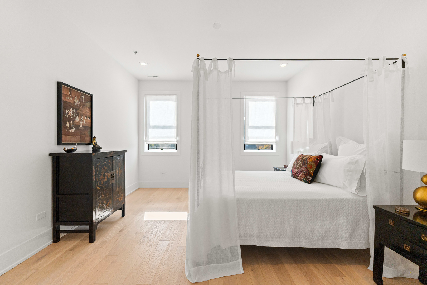 1767 West Rosehill Drive, Unit 304 Chicago, IL 60660 - Photo 12 of 36 a bedroom with a bed and wooden floor