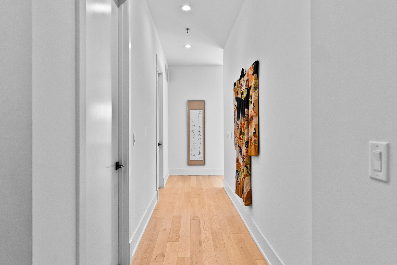 1767 West Rosehill Drive, Unit 304 Chicago, IL 60660 - Photo 2 of 36 a view of a hallway with wooden floor and entryway