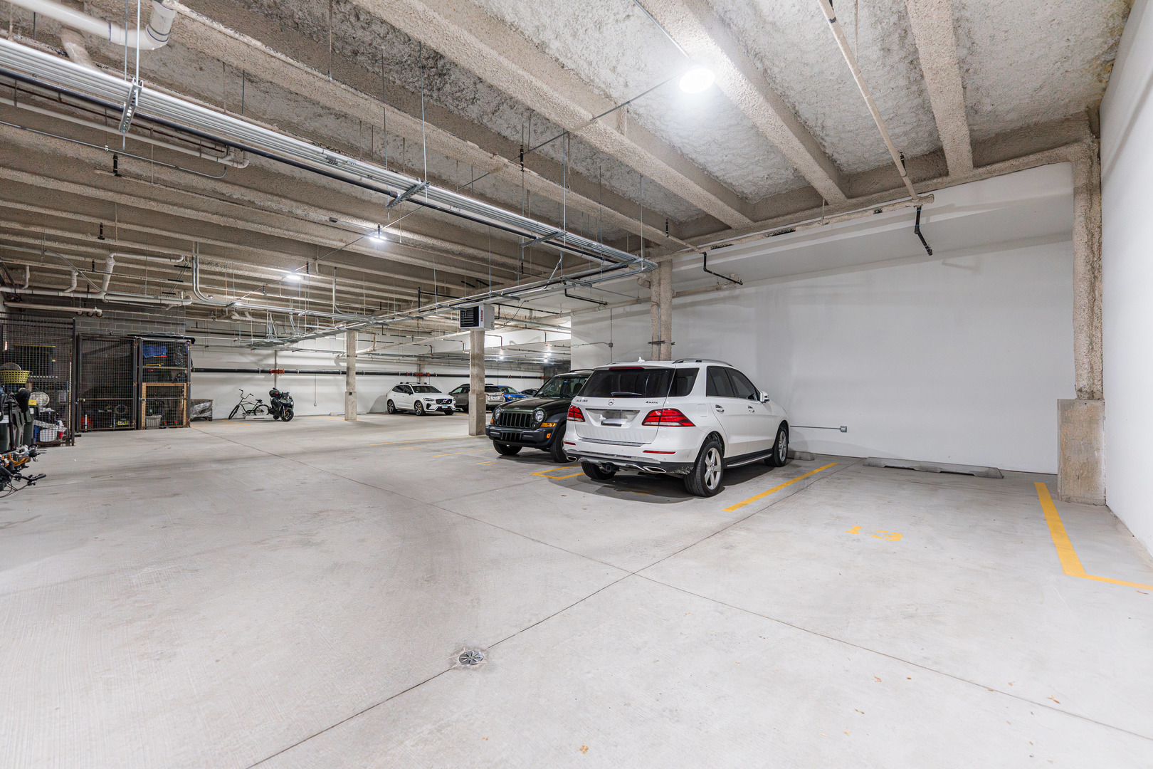 1767 West Rosehill Drive, Unit 304 Chicago, IL 60660 - Photo 30 of 36 a view of parking garage with cars