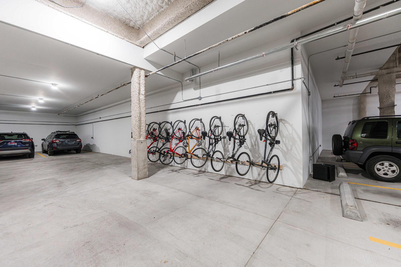 1767 West Rosehill Drive, Unit 304 Chicago, IL 60660 - Photo 31 of 36 a view of a car garage with a bike