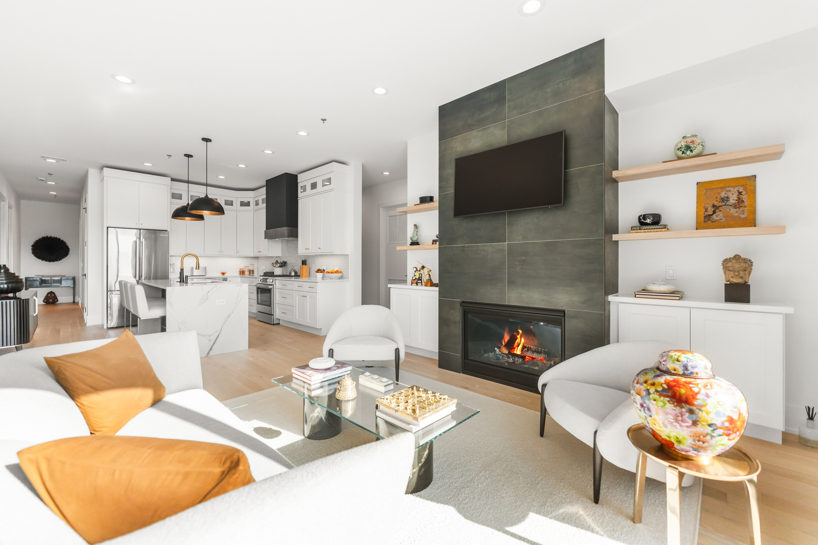 1767 West Rosehill Drive, Unit 304 Chicago, IL 60660 - Photo 6 of 36 a living room with furniture a flat screen tv and a fireplace