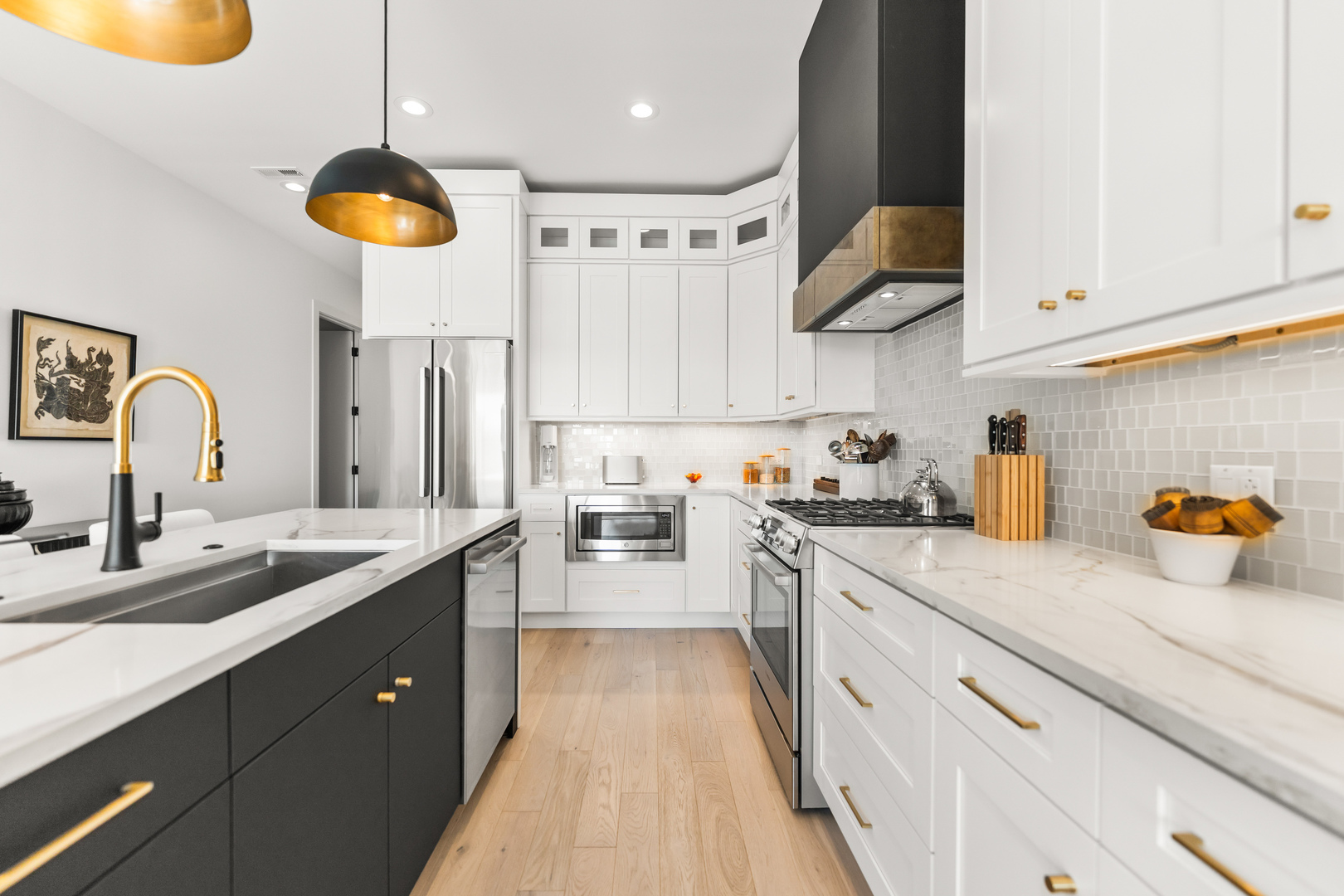 1767 West Rosehill Drive, Unit 304 Chicago, IL 60660 - Photo 10 of 36 a kitchen with stainless steel appliances granite countertop a sink a stove and a refrigerator
