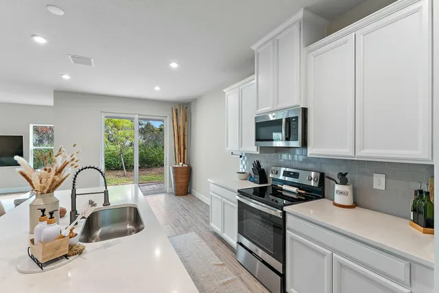 a view of a balcony with wooden floor and fence