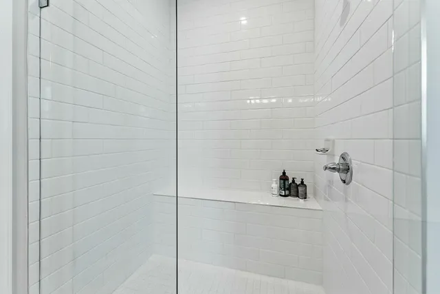 a living room with furniture a window and a chandelier