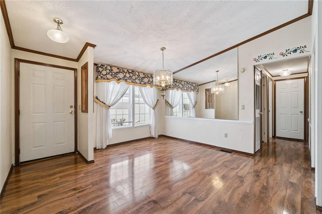 236 Ridge Lane Murrysville, PA 15668 - Photo 4 of 12 a view of an empty room with wooden floor and a window