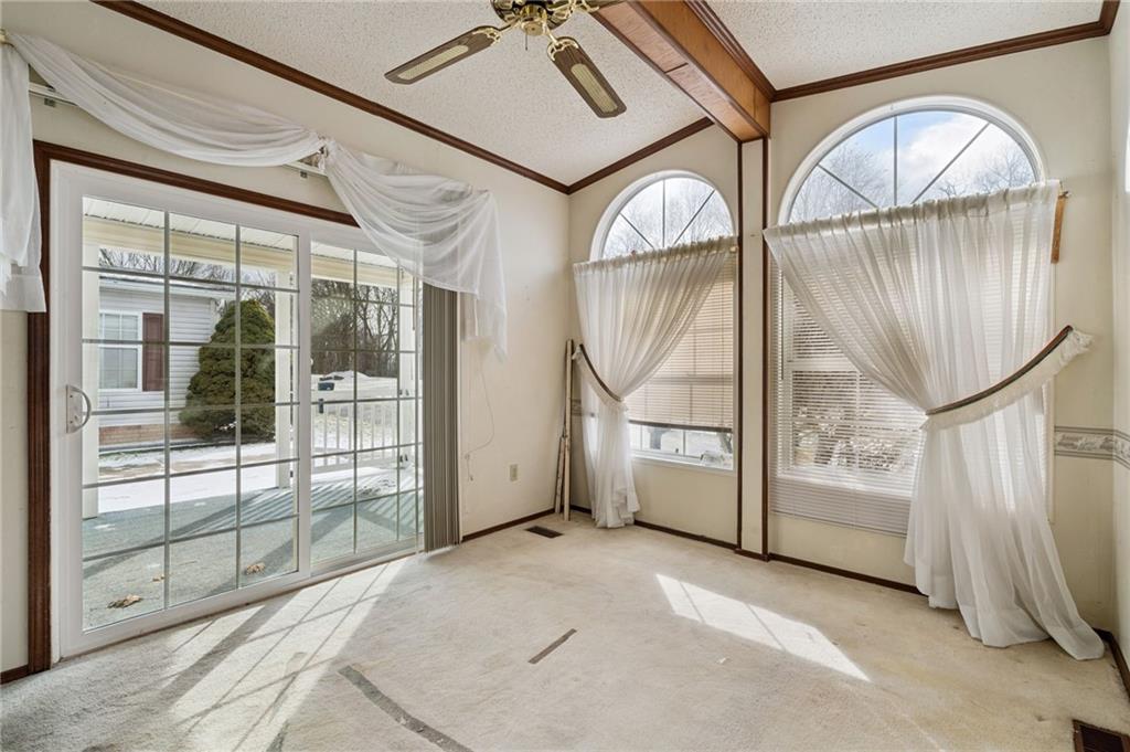 236 Ridge Lane Murrysville, PA 15668 - Photo 7 of 12 a view of a livingroom with wooden floor and windows