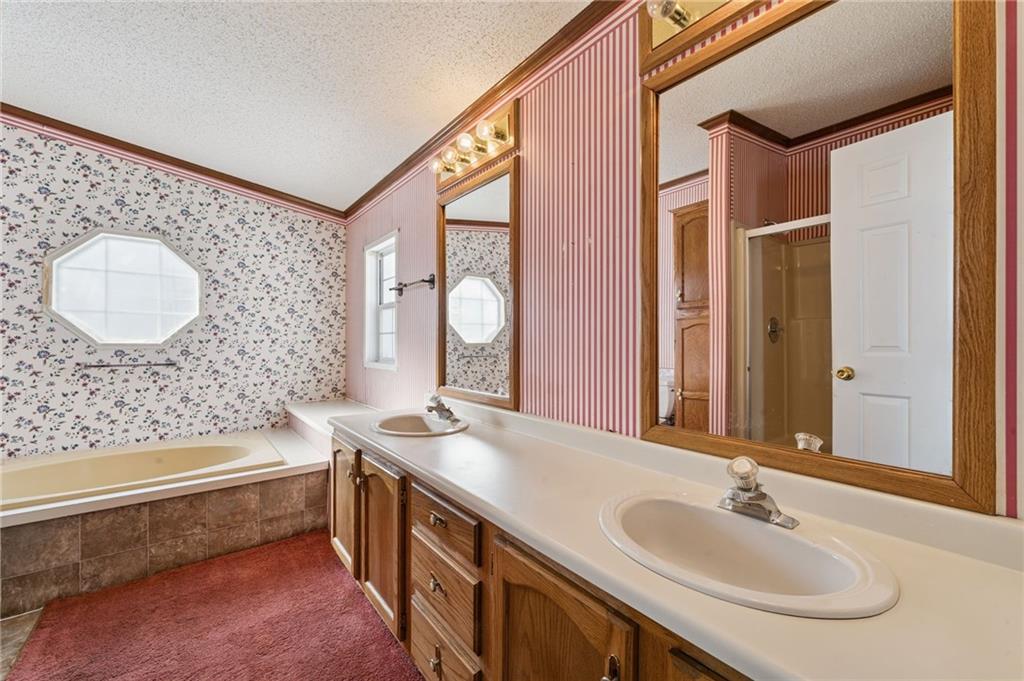 236 Ridge Lane Murrysville, PA 15668 - Photo 9 of 12 a bathroom with a double vanity sink mirror and bathtub