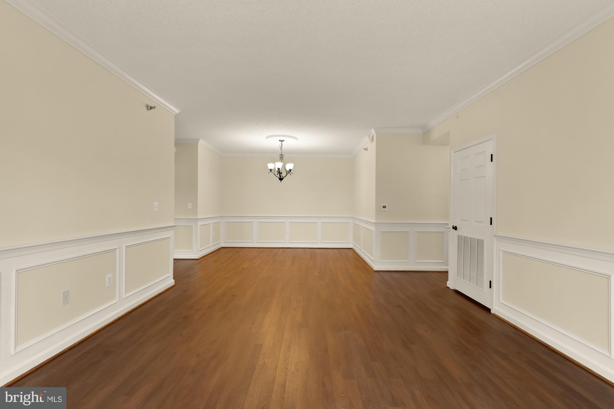 3005 South Leisure World Boulevard, Unit 201 Silver Spring, MD 20906 - Photo 16 of 38 a view of empty room with wooden floor