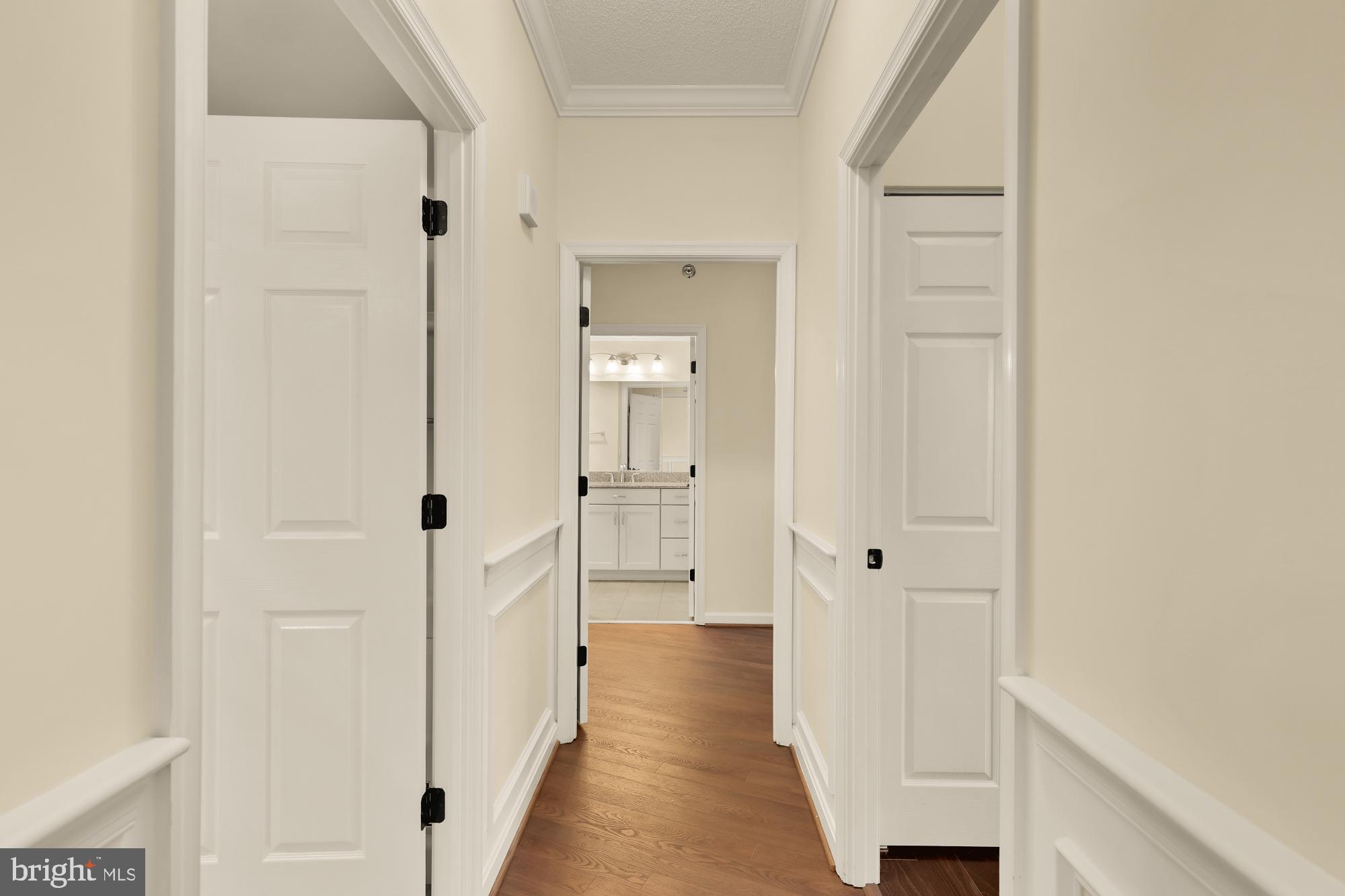 3005 South Leisure World Boulevard, Unit 201 Silver Spring, MD 20906 - Photo 20 of 38 a view of a hallway with wooden floor