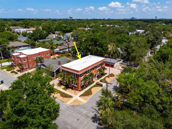 an aerial view of a house with a garden